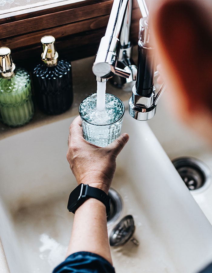 Water coming out of kitchen sink faucet